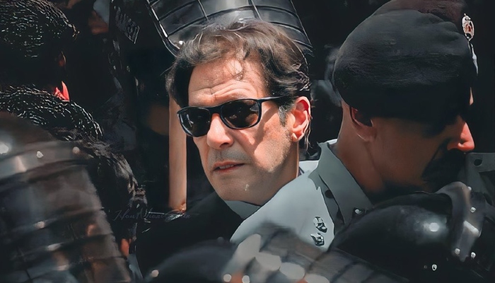 Undated photo of Imran Khan being escorted by police. — Twitter/@Bushra1Shaikh