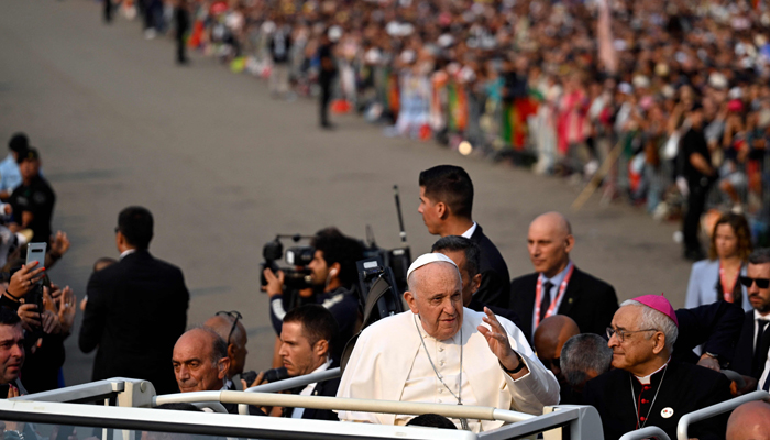 Pope Francis waves from the popemobile prior to presiding over the Holy Rosary prayer with sick young people at the Chapel of Apparitions in the Sanctuary of Our Lady of Fatima, in Fatima, on August 5, 2023. — AFP