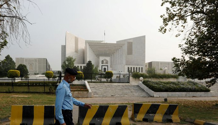 A policeman walks past the Supreme Court building in Islamabad, Pakistan October 31, 2018. — Reuters