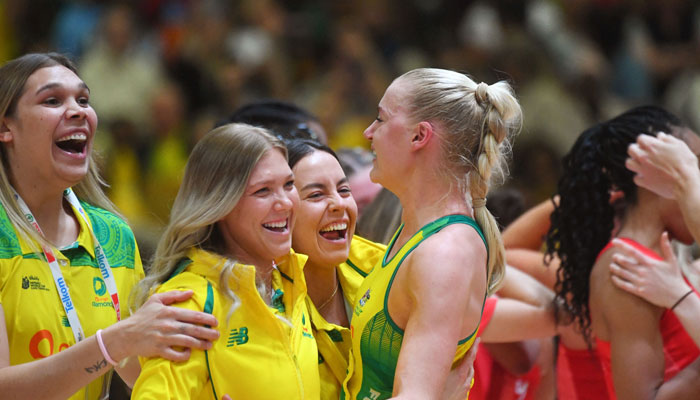 Australian players celebrate winning the final of the Netball World Cup against England, in Cape Town on 06 August 2023.—AFP