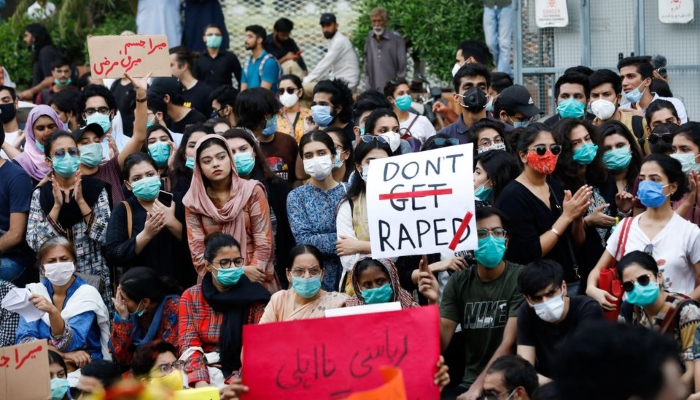 People carry signs against a gang rape that occurred along a highway and to condemn violence against women and girls, during a protest in Karachi, Pakistan September 12, 2020. — Reuters
