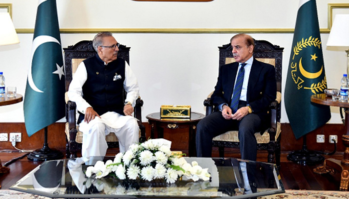 President Arif Alvi and Prime Minister Shehbaz Sharif pictured during a meeting. — Twitter/File