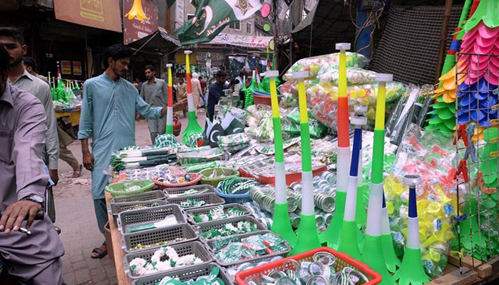 A vendor displaying decoration stuff and horns in connection with the upcoming independence day. — APP/File