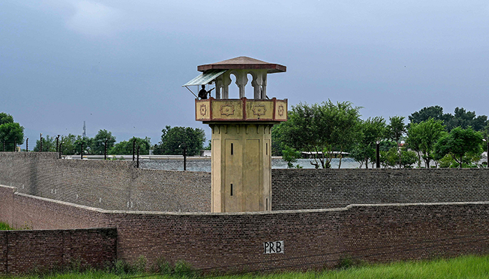 Policemen stand guard at the Attock prison post where former prime minister Imran Khan is being held for three years in Attock on August 6, 2023. — AFP