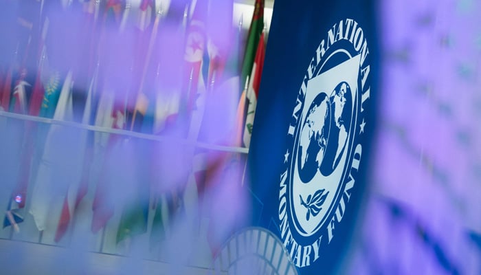 The International Monetary Fund (IMF) logo is displayed inside its headquarters in Washington, DC, on October 10, 2017. — AFP