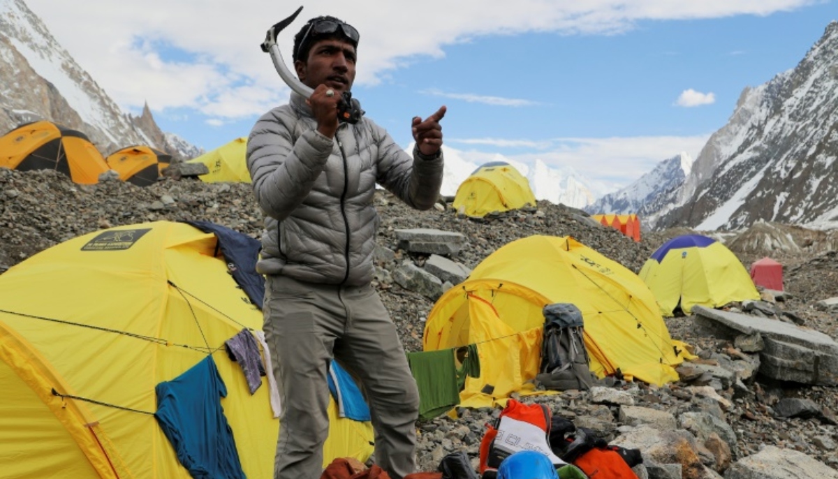 Sajid Ali Sadpara stands amid discarded tents, litter at the K2. — AFP/File