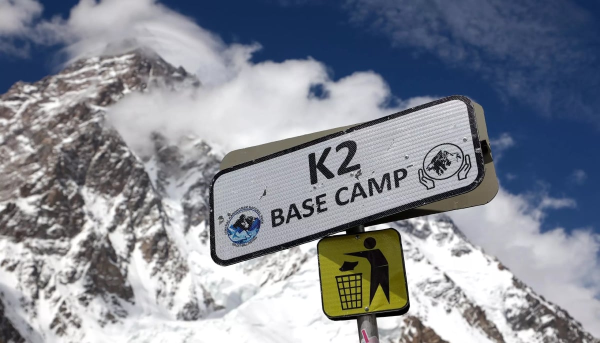 A signboard of the K2 basecamp, with a sign directing people to throw garbage in bins. — AFP/File