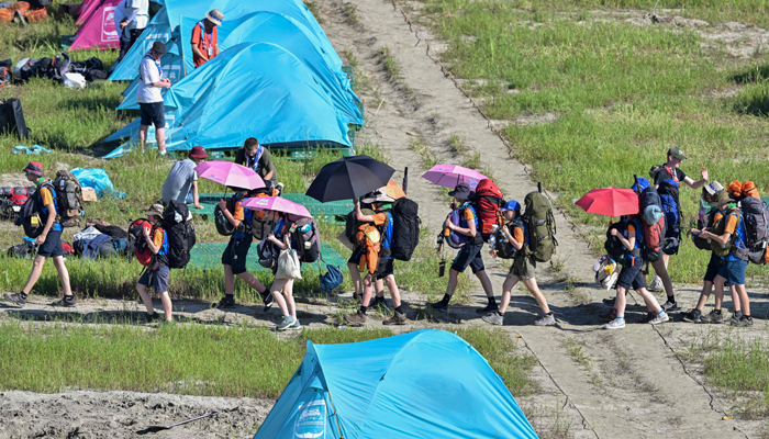 Scouts prepare to leave the campsite of the World Scout Jamboree in Buan, North Jeolla province on August 8, 2023. — AFP