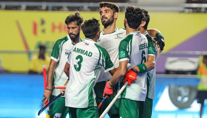 Pakistan players celebrate after scoring a goal. — AHF