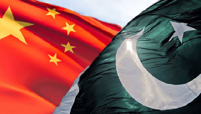 A file photo of Pakistani (right) and Chinese flags. — AFP
