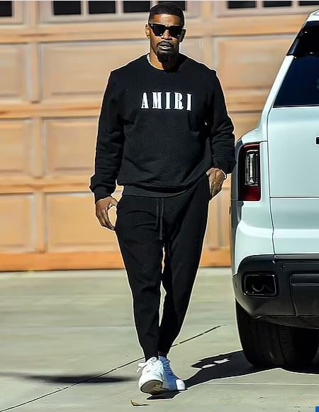 Jamie was spotted wearing a graphic-printed black sweater