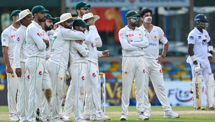 The Pakistan team watches a screen during a match. — AFP/File