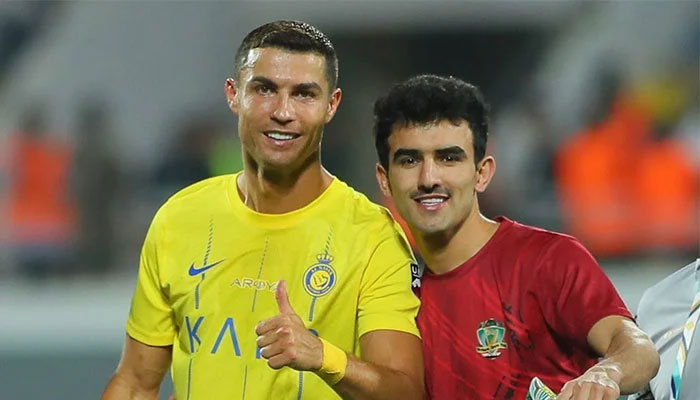 Al-Shortas Ahmed Zero poses with Cristiano Ronaldo after a match. — Instagram/@ahmed.zero31