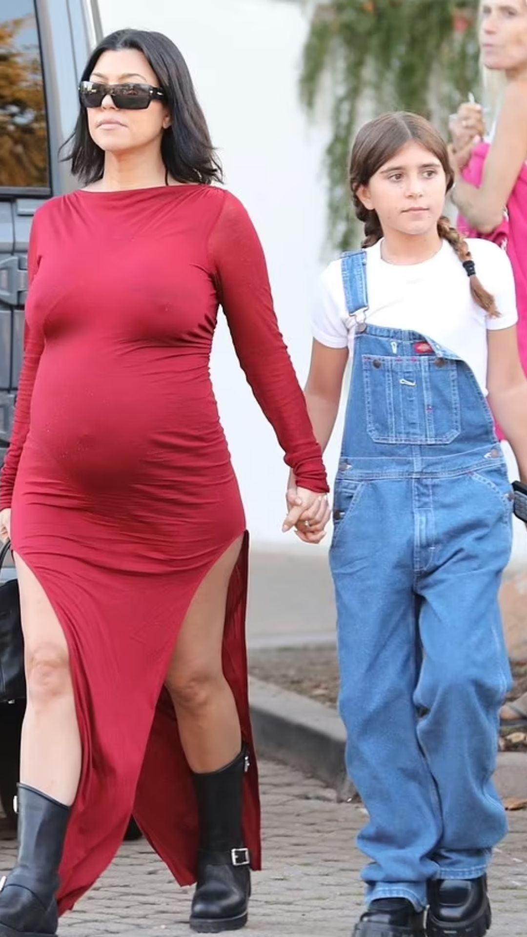 Kourtney Kardashian dons fitted red dress while out with daughter