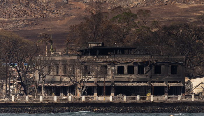 Destroyed buildings and homes are seen from a boat in the aftermath of a wildfire in Lahaina, western Maui, Hawaii on August 12, 2023. — AFP