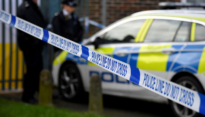 Police officers stand outside the scene of a fatal stabbing as British police said they were investigating at least five separate serious violent incidents in south London, Croydon, London, Britain, February 6, 2021. — Reuters