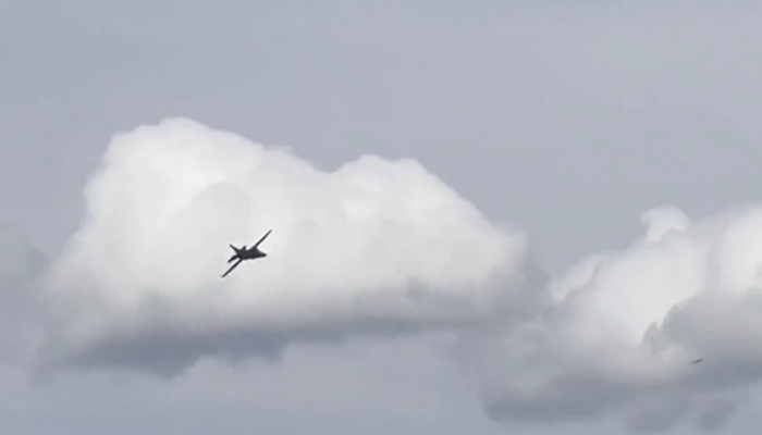 This still taken from a video circulating on social media shows a plane moments before the crash during the Thunder Over Michigan air show. — Twitter/@CBSNews