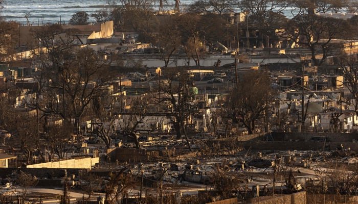 Burned houses and buildings are pictured in the aftermath of a wildfire, is seen in Lahaina, western Maui, Hawaii on August 12, 2023. — AFP