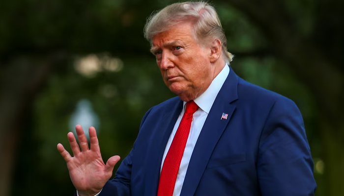 Former US president Donald Trump is waving towards the camera. — Reuters/File