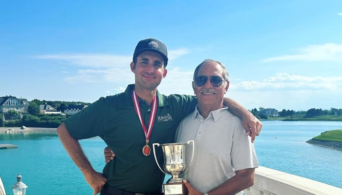 Hamza poses with his father after winning the Austrian National Open Golf Championship in Oberwaltersdorf, Austria. — Instagram/ushnashah