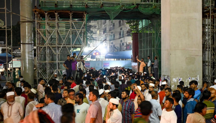 Supporters of leader Delwar Hossain Sayedee gather after his death in Dhaka. — AFP/File
