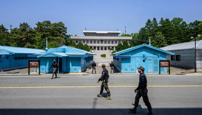 In this photo taken on May 9, 2023, South Korean soldiers walk at the truce village of Panmunjom in the Joint Security Area (JSA) of the Demilitarized Zone (DMZ) separating North and South Korea. — AFP
