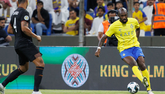 Nassr´s Ivorian midfielder Seko Fofana (R) is marked by Shababs Brazilian defender Iago Santos during the 2023 Arab Club Champions Cup match at the King Fahd Stadium in Taif on July 28, 2023. — AFP