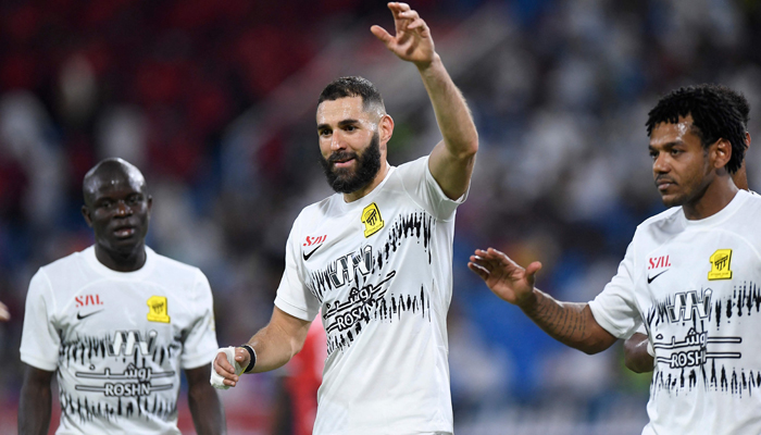 Ittihads French forward Karim Benzema celebrates with teammates after they won the Saudi Pro League football match between Al-Raed and Al-Ittihad at the King Abdullah Sports City on August 14, 2023. — AFP