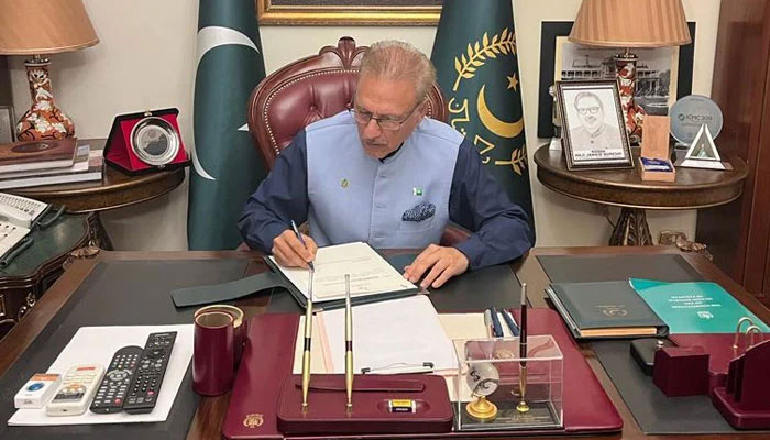 President Arif Alvi signing the PEMRA Amended Bill 2023. Twitter