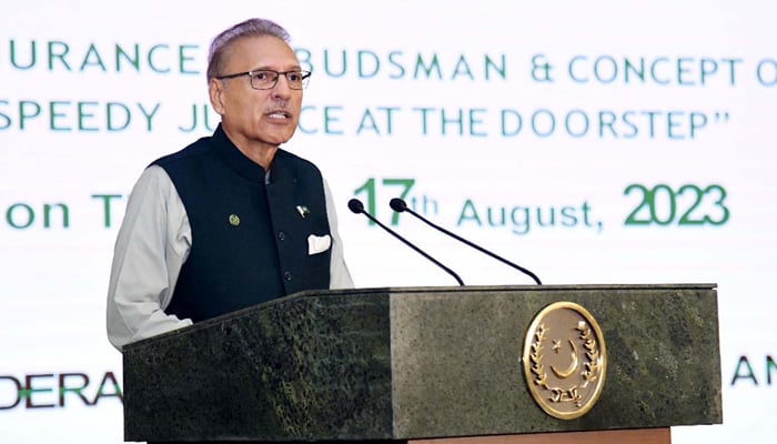 President, Dr. Arif Alvi addressing a seminar on Insurance Ombudsman and Concept of Speedy Justice at the Doorstep held at Aiwan-e-Sadr in Islamabad on Thursday, August 17, 2023. — AFP