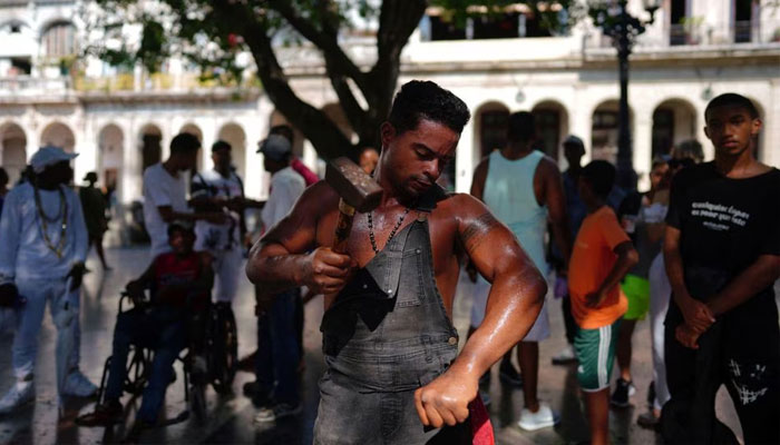 Cubas Ironman Lino Tomasen performs in downtown Havana, Cuba, on August 8, 2023.— Reuters