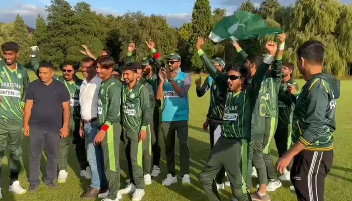 Green Shirts celebrate after victory against the Men in Blue. — Photo by author