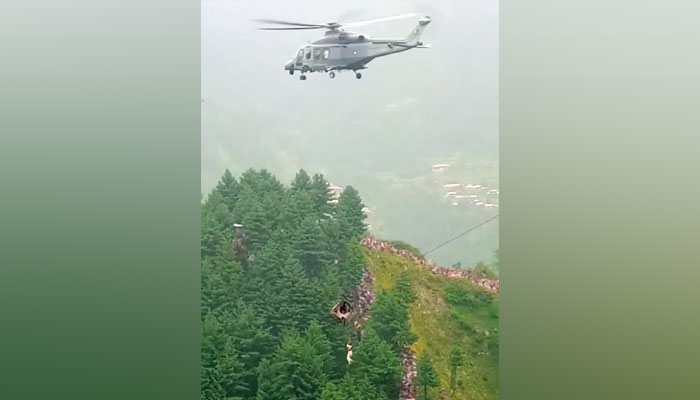 The picture shhows one of the eight people being rescued from a dangling cable car in Battagram, Khyber Pakhtunkhwa on Tuesday, August 22, 2023. — Reuters
