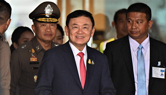 Former Thai Prime Minister Thaksin Shinawatra arrives to greet his supporters after landing at Bangkok´s Don Mueang airport on August 22, 2023. — AFP