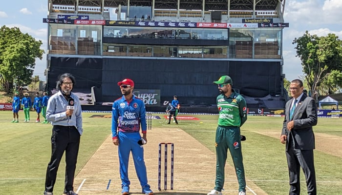 Afghanistan skipper Hashmatullah Shahidi (left) and Pakistan captain Babar Azam during the toss in the second ODI in Sri Lanka. — PCB