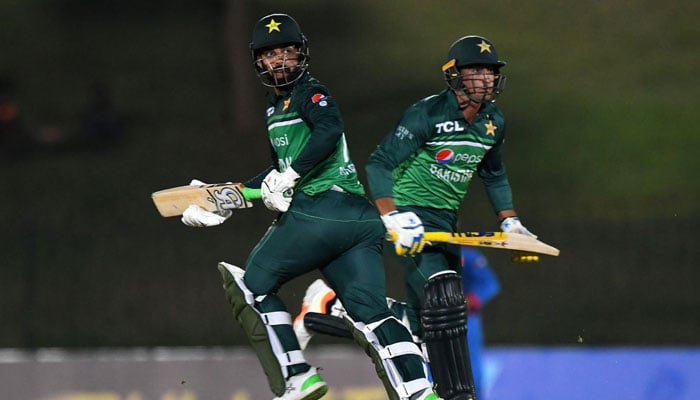 Shadab Khan and Naseem Shah (R) run between the wickets during the second ODI between Pakistan and Afghanistan at the Mahinda Rajapaksa International Cricket Stadium in Hambantota on August 24, 2023. — AFP