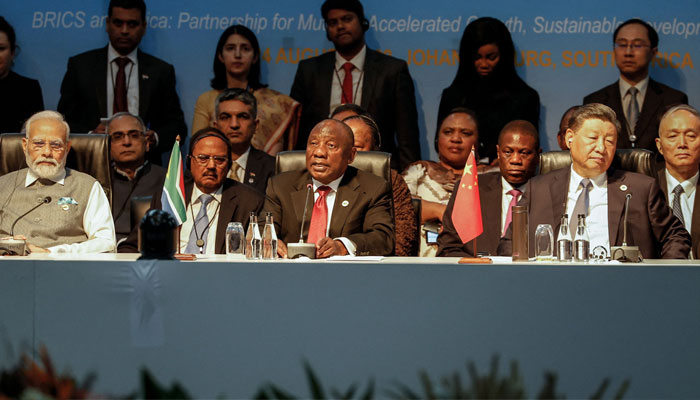 (1st row from L to R) Prime Minister of India Narendra Modi, South African President Cyril Ramaphosa and President of China Xi Jinping attend a meeting during the 2023 BRICS Summit at the Sandton Convention Centre in Johannesburg on August 24, 2023.—AFP