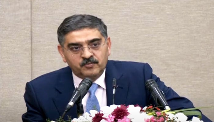 Caretaker Prime Minister Anwaar-ul-Haq Kakar addressing the ceremony in honour of those who participated in the Battagram rescue operation, on August 24, 2023. — Radio Pakistan