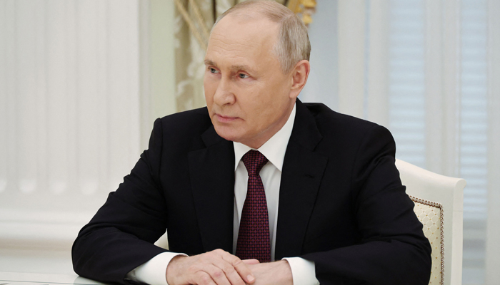In this photograph, Russias President Vladimir Putin looks on during a meeting in Moscow, on August 24, 2023. —