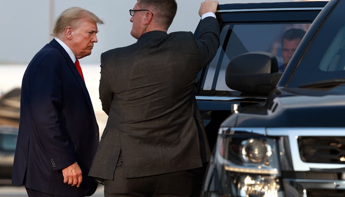 Former US President Donald Trump arrives at Atlanta Hartsfield-Jackson International Airport on August 24, 2023 in Atlanta, Georgia. — AFP