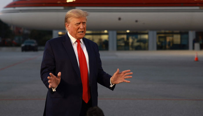 Former US President Donald Trump speaks to the media at Atlanta Hartsfield-Jackson International Airport after surrendering at the Fulton County jail on August 24, 2023 in Atlanta, Georgia. — AFP