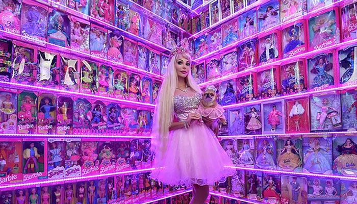 Tatiana Tuzova with her Barbie dolls collection. — Reuters