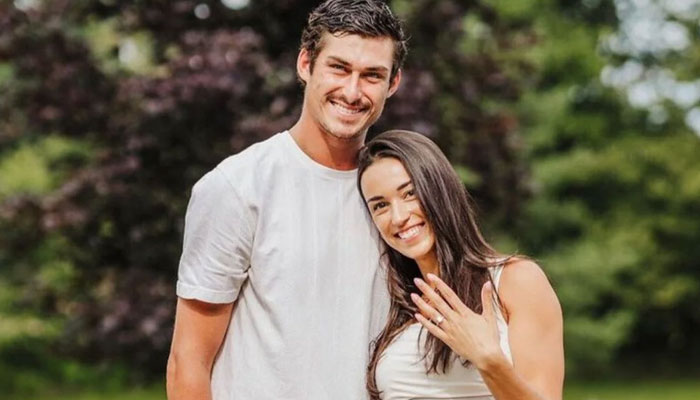 Mason Marchments girlfriend Alexis Durham poses along with her fiance while showing engagement ring to the camera. Instagram