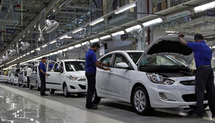 Workers assemble cars inside the Hyundai Motor India Ltd. plant at Kancheepuram district in the southern Indian state of Tamil Nadu October 4, 2012. — Reuters