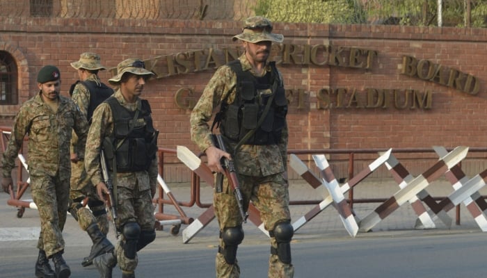 Pakistani soldiers patrol outside the Gaddafi Stadium in Lahore, October 25, 2017. — AFP