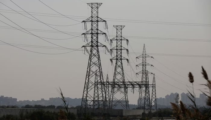 A power transmission tower is seen a day after a country-wide power breakdown, in Karachi, Pakistan, January 24, 2023. — Reuters
