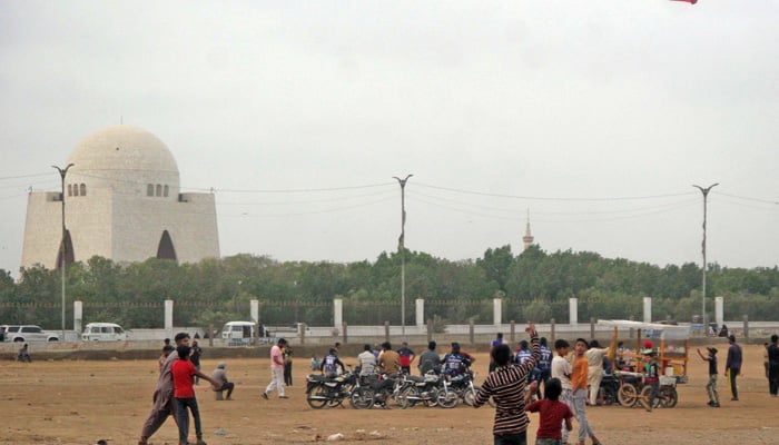 Youngsters fly kites at the Bagh-e-Jinnah in Karachi on August 20, 2023. — Online