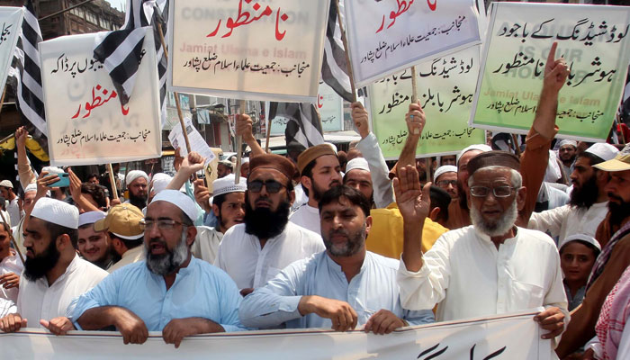 Members of Jamiat Ulema-e-Islam-Fazl (JUI-F) are holding a protest demonstration against the highly inflated electricity bills, held in Peshawar on Sunday, August 27, 2023. — PPI