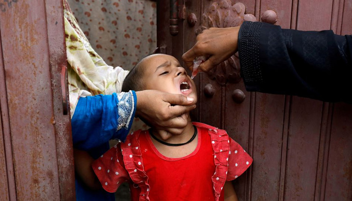 A girl receives polio vaccine drops, during an anti-polio campaign, in a low-income neighborhood as the spread of the coronavirus disease (COVID-19) continues, in Karachi, Pakistan July 20, 2020. — Reuters