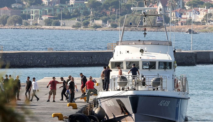 The image shows migrants arriving at Greek island of Lesbos. — Reuters